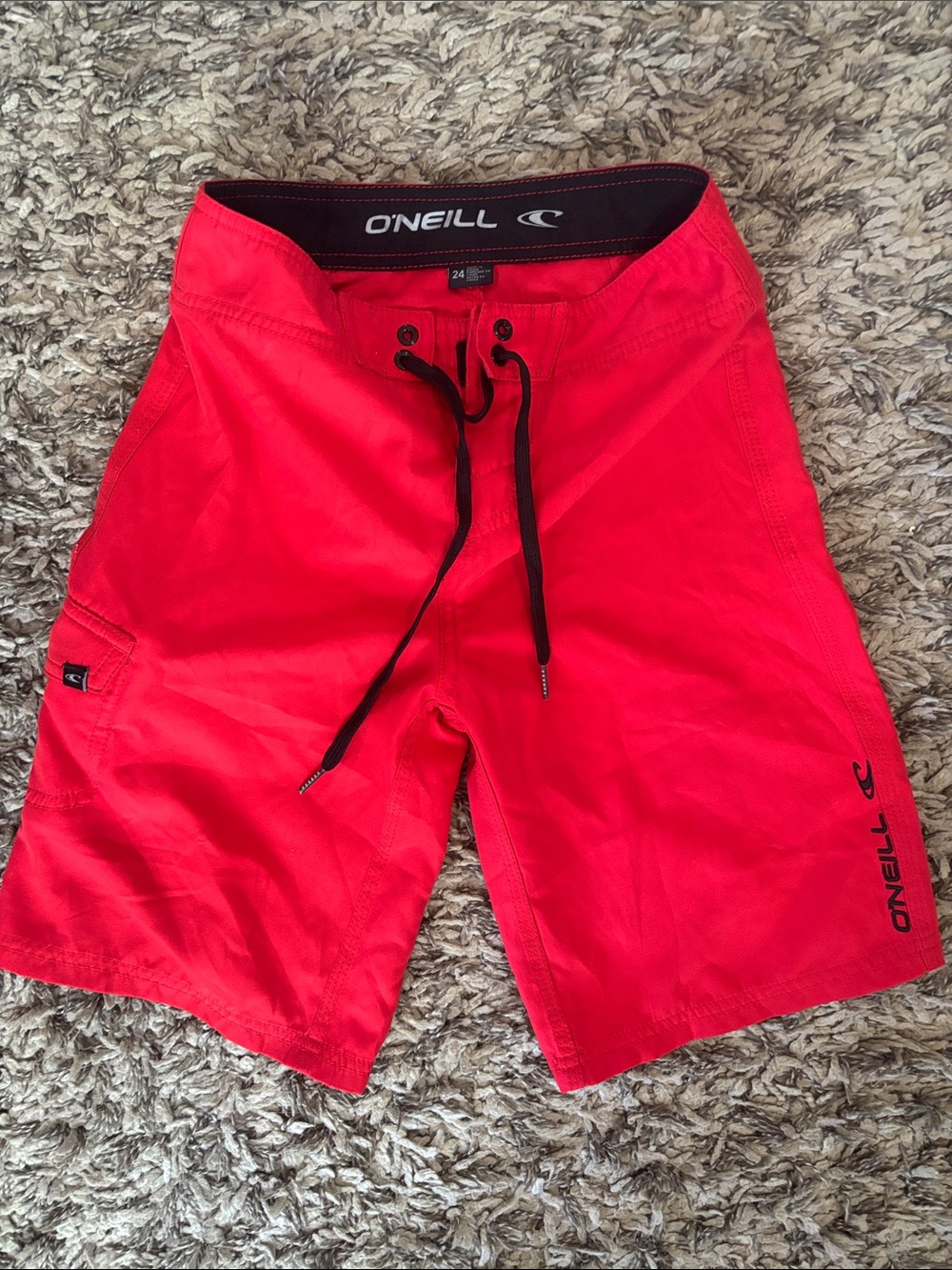 O'Neill Kids Red Swim Trunks with Black Drawcord and Velcro waist.